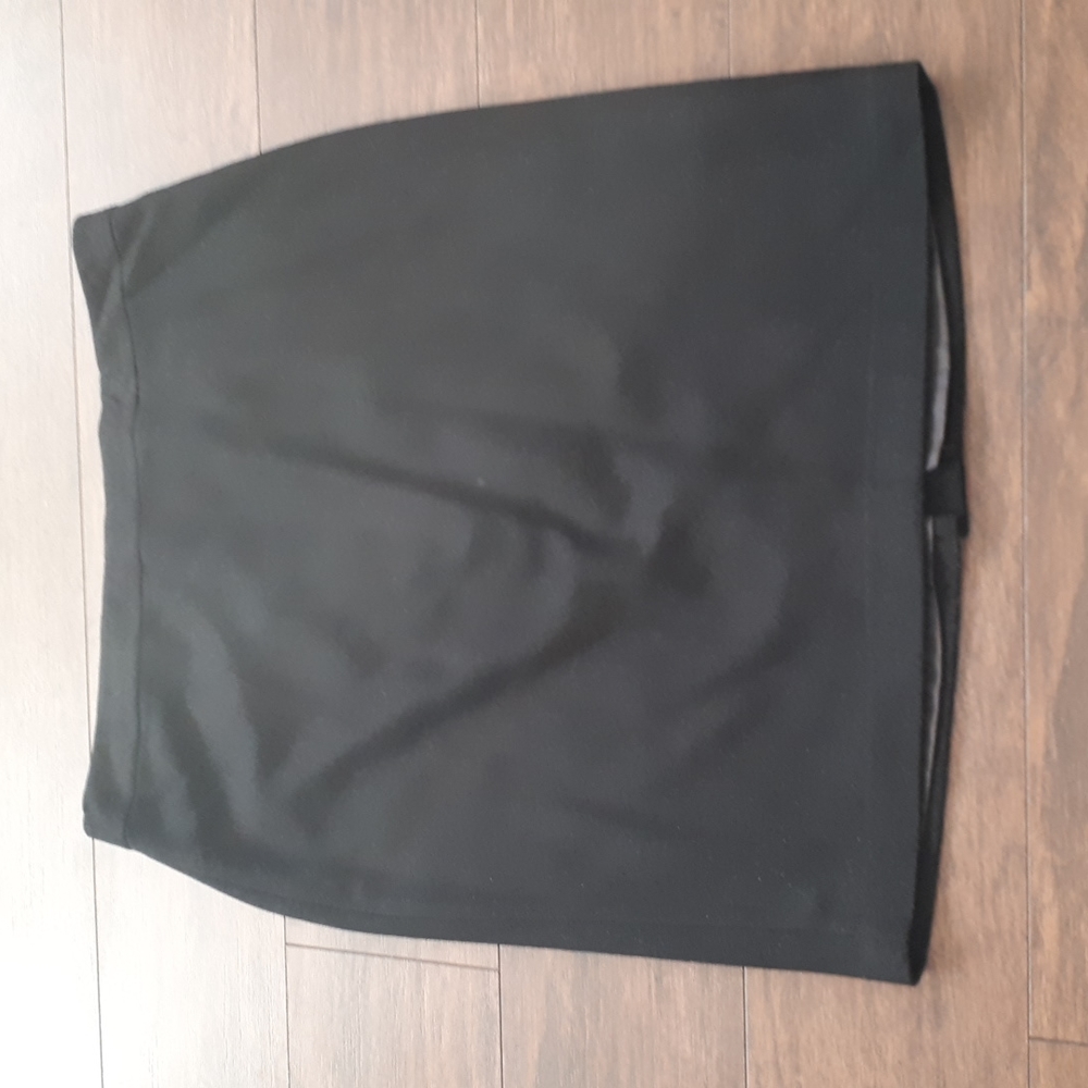 Black poly/wool lined skirt by Tradition.  Size 12